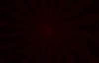 A spiky red mass is in the center of the image, with additial spikes running to the edges of the image. The image is somewhat eerier and dark.